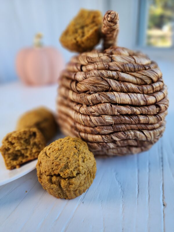 Pumpkin Muffins next to wicker pumpkin decor - Vegan Protein Pumpkin Muffins