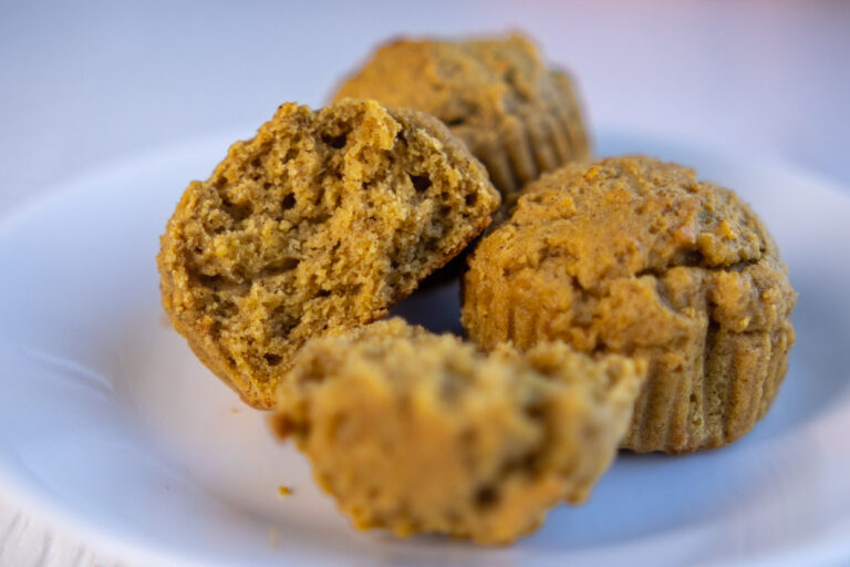 Up close of Pumpkin Muffins with One Broken Open - Vegan Protein Pumpkin Muffins