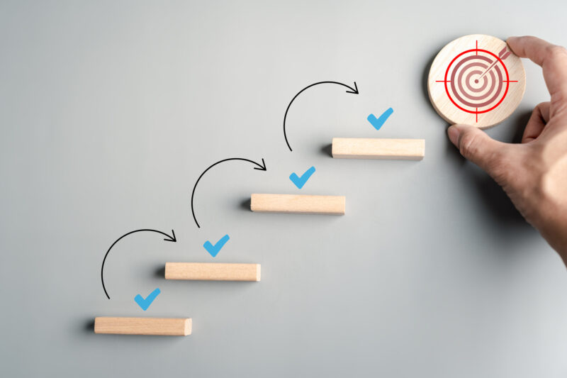 Goal checklist and step to success with wooden blocks arranged as stairs check marks and target progress achievement and business planning - At Home With Mackenzie Goal checklist and step to success with wooden blocks arranged as stairs, check marks, and target progress, and achievement